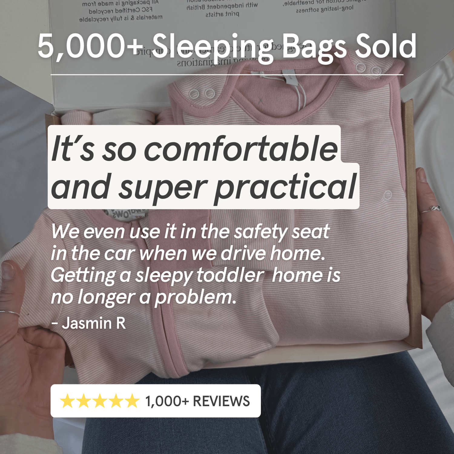 A person holding a box containing a Pink pinstripe bamboo Smart baby sleeping bag 2.5 tog from GrowGrows, with promotional text overlays reading '5,000+ Sleeping Bags Sold' and customer review copy. The scene includes hands, clothing, and part of a bed or chair in a real indoor setting.