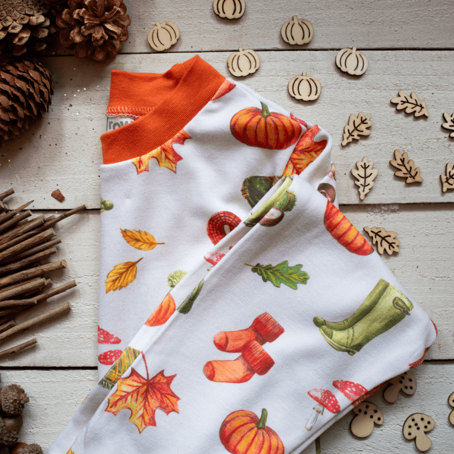 Folded close up of the Autumnal Amazes Pyjamas with pumpkin and autumn print made from bamboo and organic cotton from GrowGrows