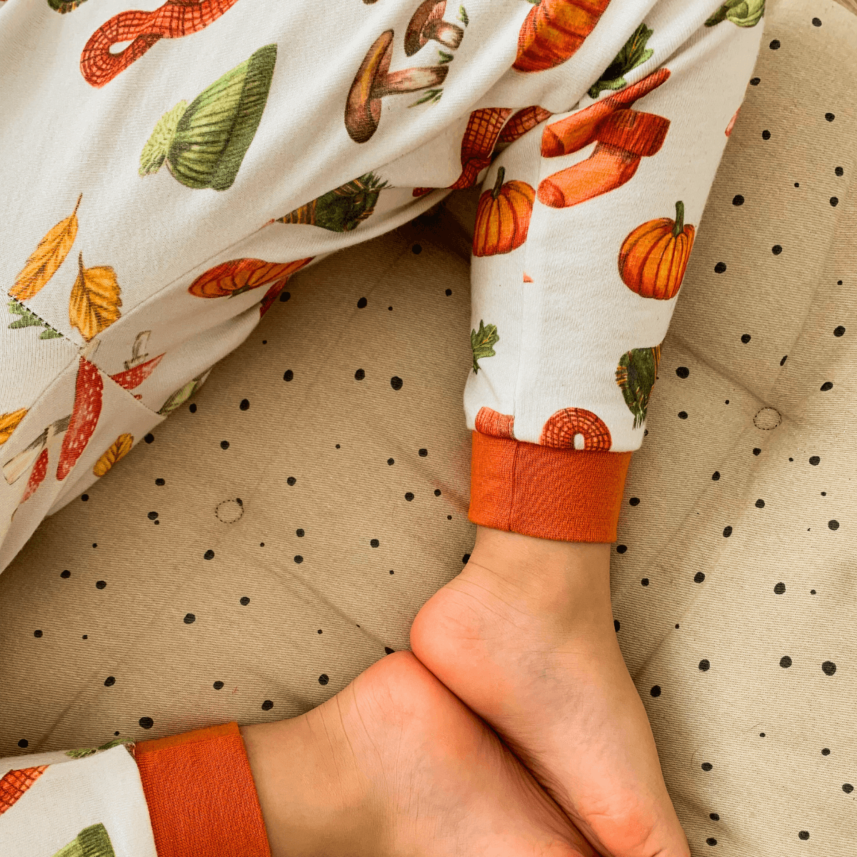 Close up on the legs and cuff of the Autumnal Amazes Pyjamas with pumpkin and autumn print made from bamboo and organic cotton from GrowGrows