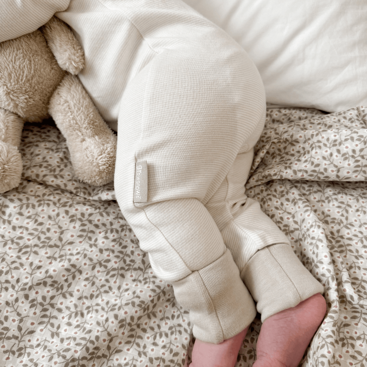 Close up on the legs and foldover socks on the Cashmere Pinstripe Sleepsuit with classic stripe design made from bamboo and organic cotton from GrowGrows