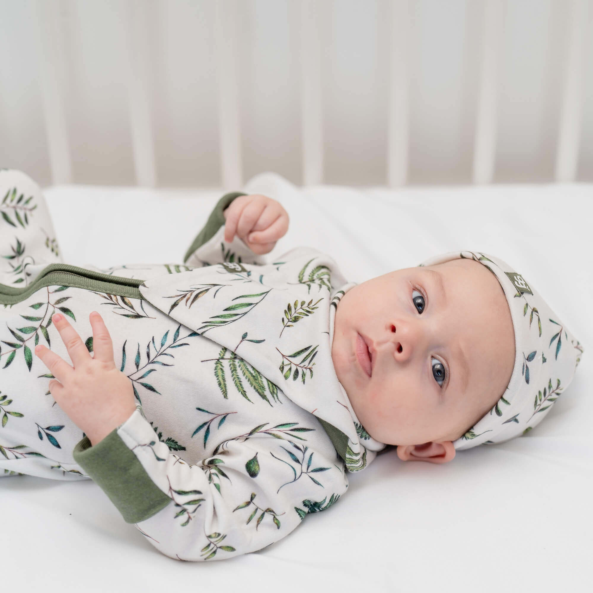 Baby wearing a matching Sleepsuit, Baby Bib and Baby Bib from GrowGrows