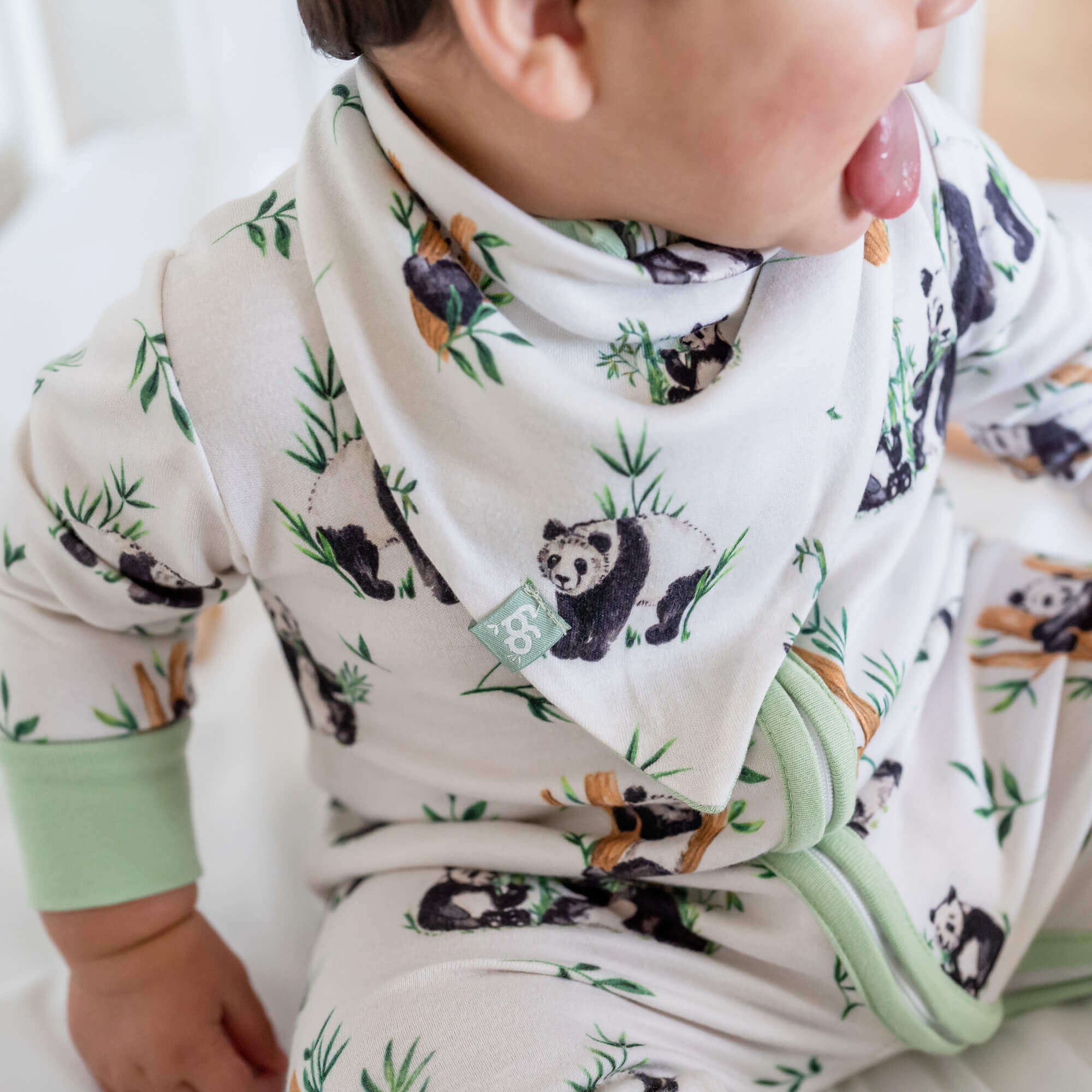 Baby wearing the Fleeting Fawns Baby Bib from GrowGrows