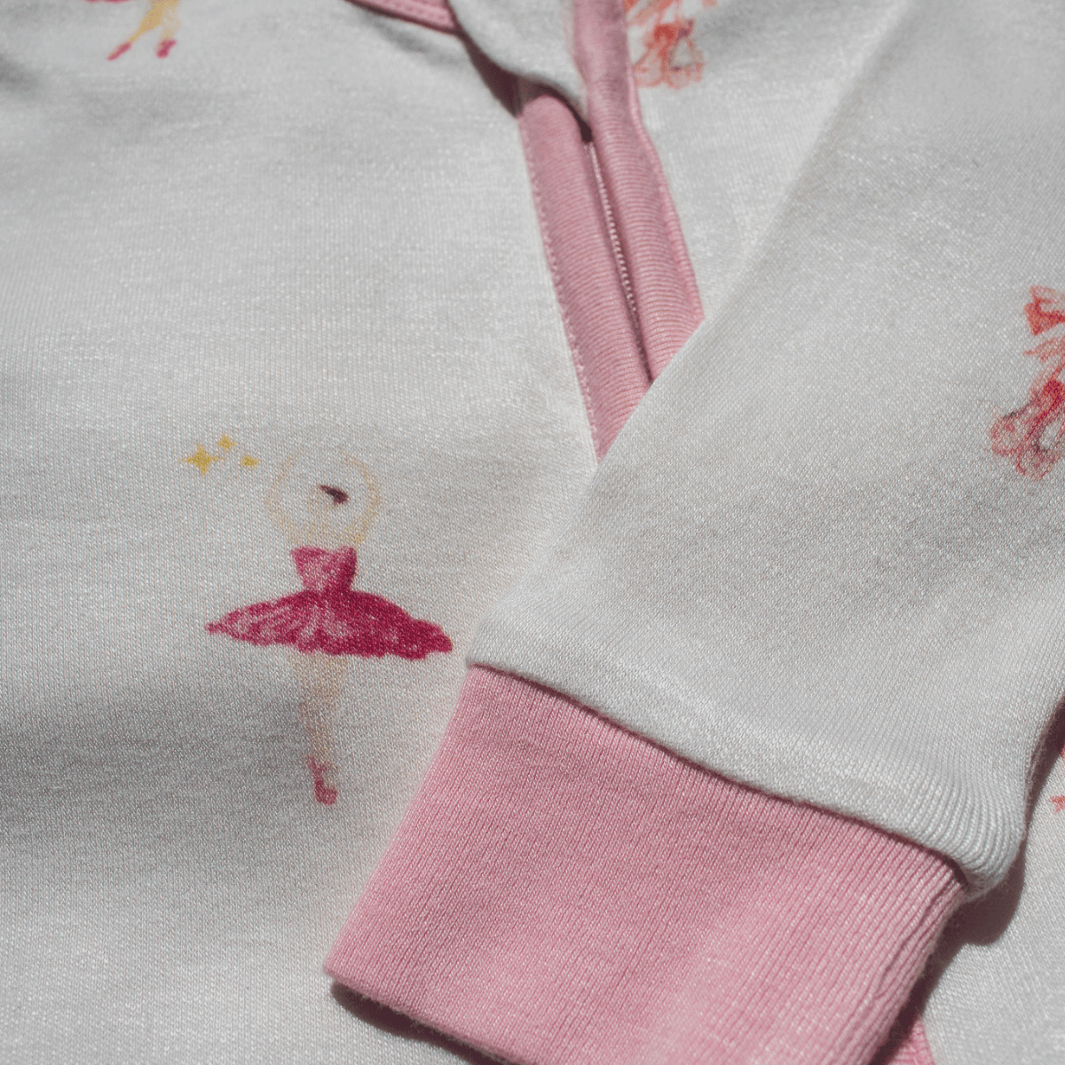 Close up of the Tiny Twirls Sleepsuit with ballerina print made from bamboo and organic cotton from GrowGrows