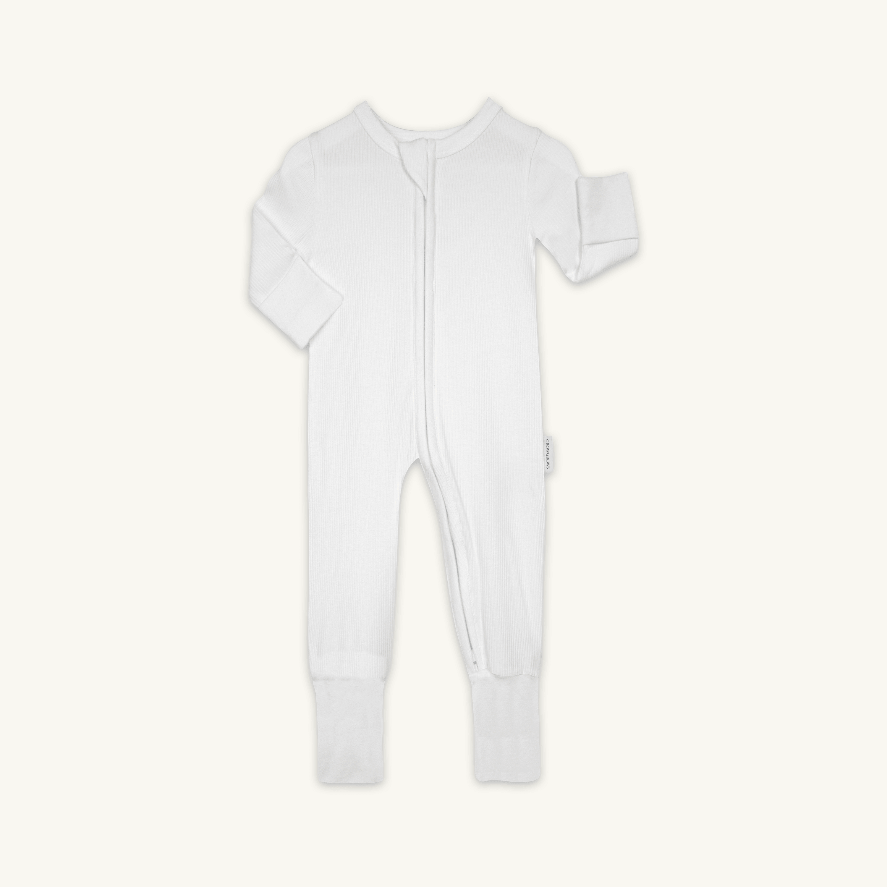 The White Ribbed Sleepsuit from GrowGrows laid flat