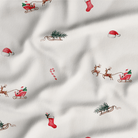 Close up of the print on the Christmas Eve Pyjamas with Santa and reindeer print made from bamboo and organic cotton from GrowGrows