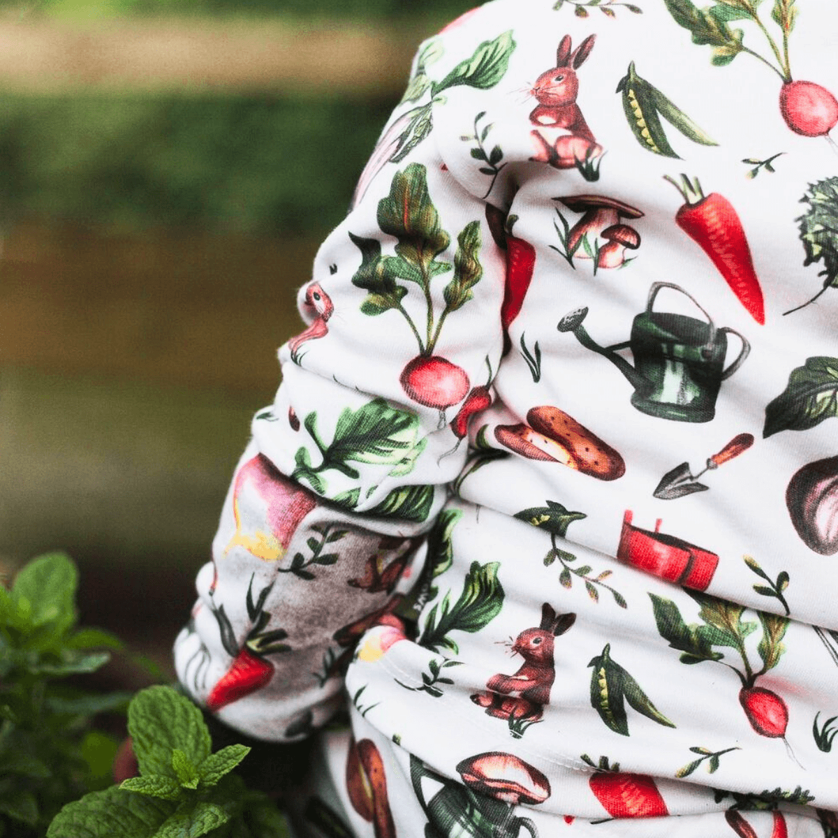 Close up of a the Allotment Adventure Pyjamas with vegetable allotment print made from bamboo and organic cotton from GrowGrows