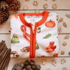 Folded Autumnal Amazes Sleepsuit with pumpkin and autumn print made from bamboo and organic cotton from GrowGrows