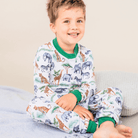 Child wearing the Safari Slumber Pyjamas with safari animal print made from bamboo and organic cotton from GrowGrows