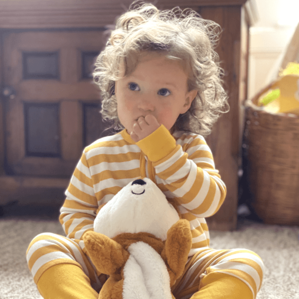Toddler Emmie wearing Mustard Stripes Sleepsuit